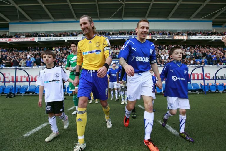 Robbie Savage stepping out onto the pitch.